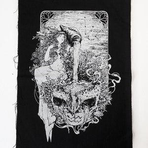 May include: Black fabric patch with a white illustration of a woman pouring water from a vessel, surrounded by floral and skull imagery. The design includes a constellation and decorative border. The patch has raw edges.
