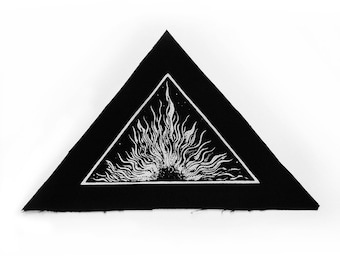 May include: Black triangular patch with a white stylized sunburst design inside.