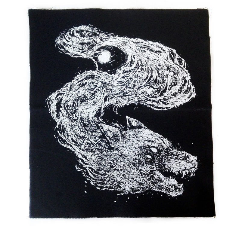 May include: Black square patch with a white illustration of a wolf's head and flowing, cloud-like shapes. The wolf is snarling, with visible teeth. The design is detailed and artistic, suitable for clothing or accessories.