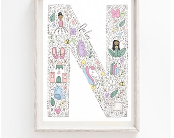 May include: A white framed print featuring a large letter N in the centre. The letter is filled with colourful illustrations of flowers, butterflies, a unicorn, a castle, a bird, an elephant, and other whimsical designs. The name "Noelle" is written in cursive in the top left corner of the print.