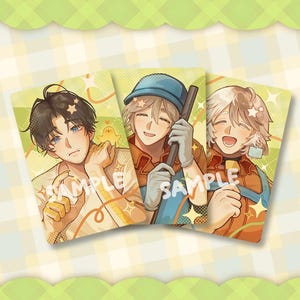 May include: Three illustrated cards with anime-style characters. Each card shows a different character with distinct outfits and hairstyles. The cards have a soft, pastel colour palette with the word "SAMPLE" printed on each card.