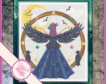 May include: A cross stitch pattern featuring a figure with large black wings and a long blue dress standing before a circular frame. The design includes a yellow crescent moon, small birds, and colorful beads. The text Stitch Doodle is visible.