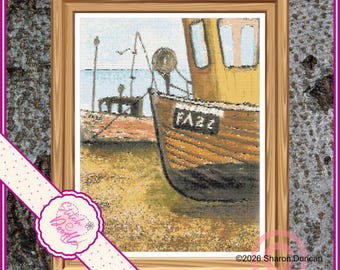 May include: A framed cross-stitch pattern depicting a wooden fishing boat resting on a sandy shore. The boat is brown with a black hull and features the text PA22 on its side. The background shows a calm blue sea and a distant pier structure.