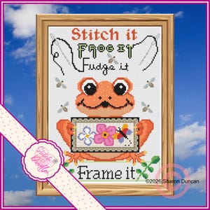 May include: Cross-stitch art featuring an orange frog holding a sign with flowers and a butterfly. The framed artwork includes the text "Stitch it, Frog it, Fudge it, Frame it." The design is set against a sky background.