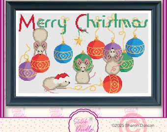 May include: A framed cross-stitch pattern featuring the text Merry Christmas in red and green letters. The design includes four light-colored mice interacting with colorful hanging ornaments in red, blue, purple, and green, plus a small yellow star.