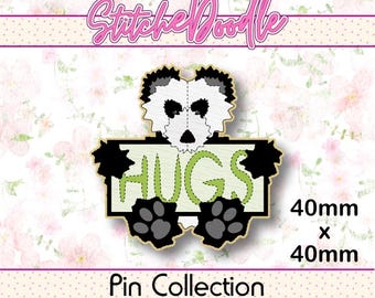 May include: A panda-themed enamel pin measuring 40mm x 40mm. The design features a white and black panda head above a light green rectangular sign with the word HUGS in dark green stitching. Two black paw prints are at the bottom.