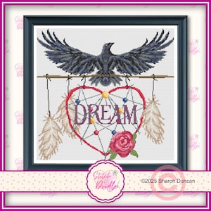 May include: Cross-stitch design featuring a black raven with outstretched wings above a heart-shaped dreamcatcher. The dreamcatcher has the word "DREAM" in the center, with feathers and a rose. The design is framed in a black frame.