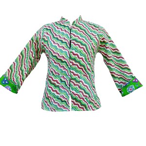 May include: A colorful, open-front jacket with a unique wavy pattern in green, red, and white. The jacket features long sleeves and a mandarin collar. The cuffs and sleeve ends have a floral design.