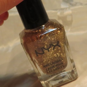gold glitter Nail color Lacquer polish enamel Item NNL05--Pot of Gold shade Full size .40 fl. oz. NYX brand Sale InonasCosmetics