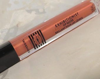Soft pretty coral Lip Gloss shade 190-Pixie Full sz. .12 fl. oz. 4-7/16" Built-in sponge tip applicator Wear over lipstick InonasCosmetics