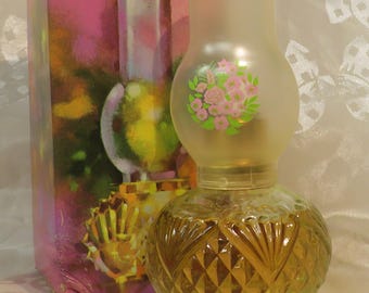 Avon Hurricane Lamp fragrance Mist spray Almost full w/pink flowers & leaves on top Embossed bottle holds 2 oz. Patchwork Cologne 1970s