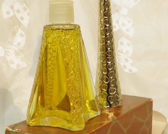 Avon Topaze fragrance Giraffe Gold tone head and neck 1.5 fl. oz. Almost 8" tall Cologne Full embossed heavy-gauge bottle New condition