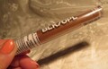 Bronze Brightening face Concealer BLK/OPL (Black Opal) Maple Mane shade Sealed Full size .10 fl. oz. 4-3/4" long Clear tube InonasCosmetics