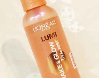 Lumi face Dew Mist-100 Full sz. 6" tall 3 oz. Shake & Glow Non-aerosol Primes-Hydrates-Refreshes Non-greasy Extends makeup wear Loreal Paris