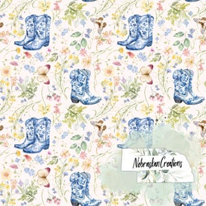 May include: A repeating pattern featuring blue and white cowboy boots with floral designs, butterflies, and various flowers in shades of pink, yellow, and blue on a cream background. The design includes the text "Nebraskan Creations".