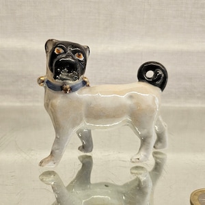 Meissen porcelain pug figurine. 1900s. Porcelain dog figurine.