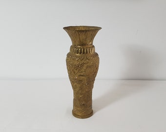 Beautiful chiseled and embossed brass vase with Asian decorations made in an old shell casing.