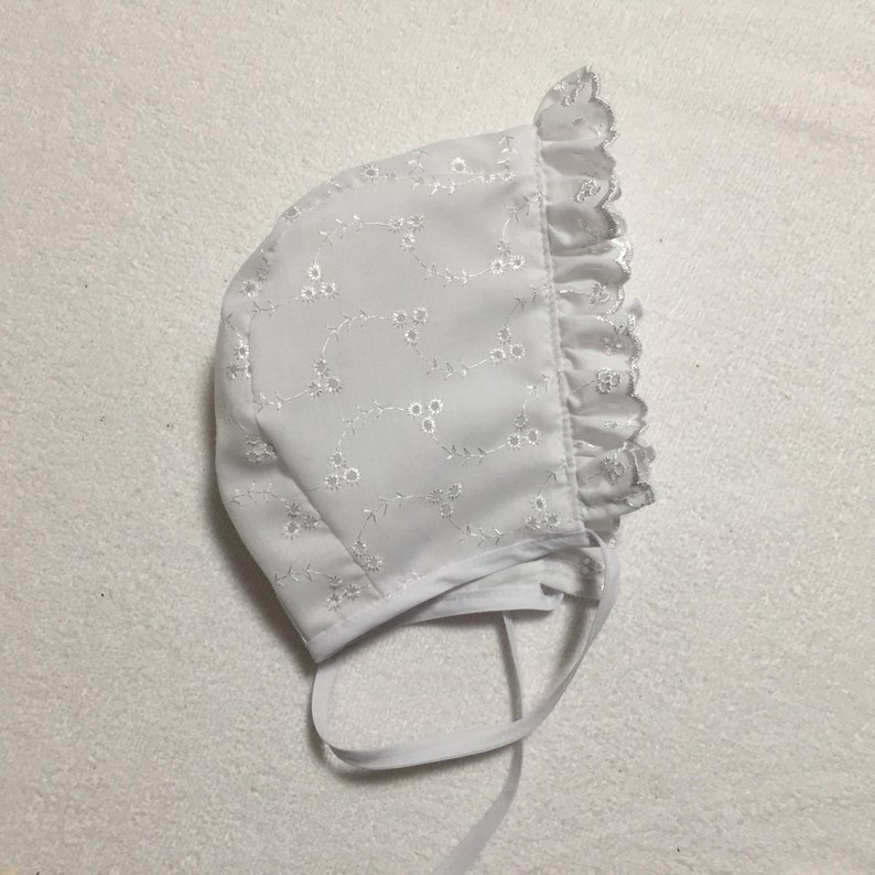 white eyelet baby bonnet