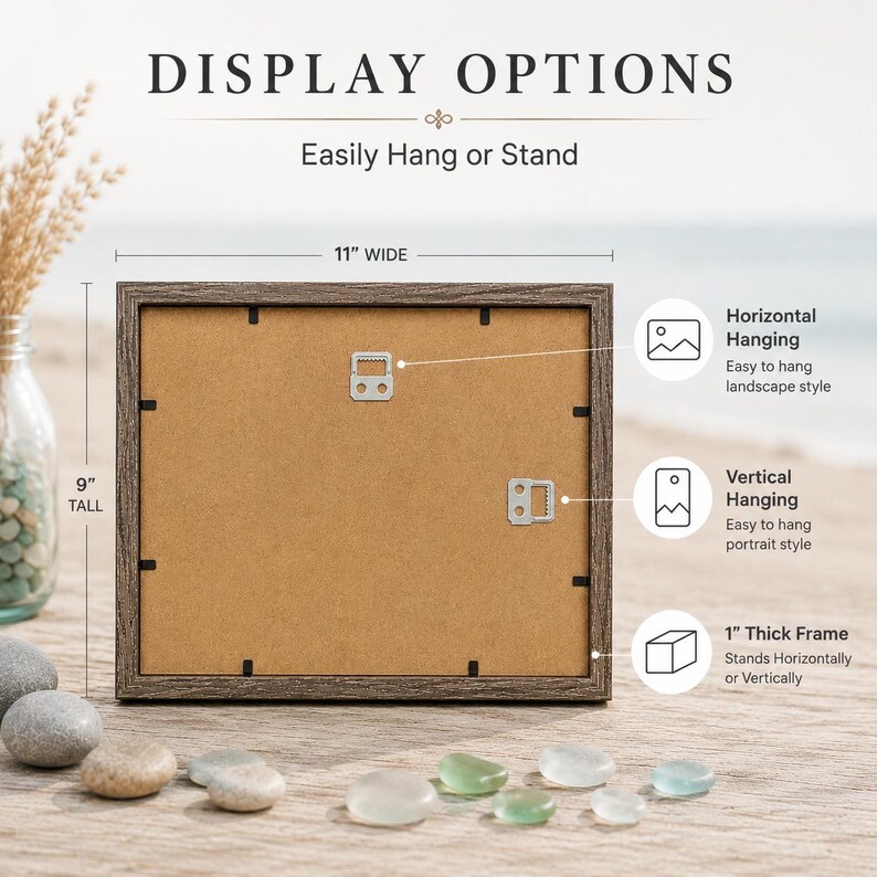 May include: A rectangular picture frame with a dark wood-grain finish, shown from the back. The frame measures 11 inches wide by 9 inches tall and features a 1 inch thick frame. It includes metal hardware for horizontal or vertical hanging.