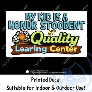 May include: A white printed decal with the text "MY KID IS A HONUR STOODENT AT Quality Learing Center". The decal features a treehouse graphic and is suitable for indoor and outdoor use.