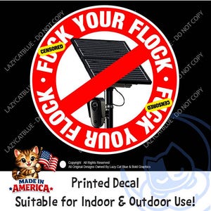 May include: A circular red and white decal featuring a black solar panel and security camera graphic with a red diagonal slash. The text reads FUCK YOUR FLOCK with yellow CENSORED labels. A small cartoon cat holds an American flag in the corner.