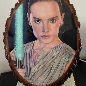 REY - Daisy Ridley as Rey from the rise of Skywalker epoxy resin covered color pencil drawing  on basswood, original  art piece.