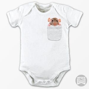 May include: White baby onesie with a gray pocket. A rat is peeking out of the pocket.