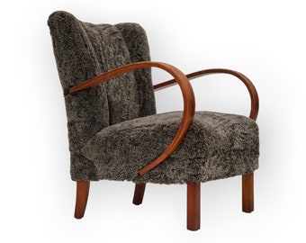 Années 1950, design danois, fauteuil rénové, véritable peau de mouton « Wellington ».