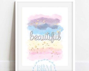 May include: A framed art print featuring a watercolor design with pastel colors and gold accents. The word "beautiful" is written in cursive across the center of the artwork. The artwork is in a white frame.
