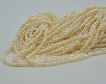 Perles de rocaille baroques d'eau douce Keshi - Blanc crème - 2 mm - 3 mm - 14 po. sur fil