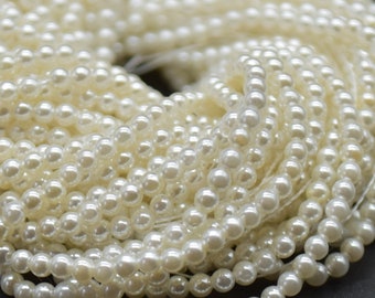 Perles rondes en coquillage 2 mm - 15" sur fil