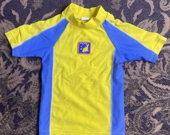 Camiseta de surf vintage Spud para niños con diseño de delfines, talla 2T