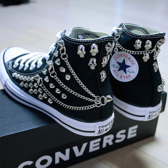 black patterned converse
