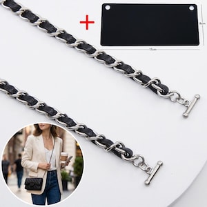 May include: A silver-toned metal chain strap interwoven with a black leather-like strip, featuring toggle bar ends. Included is a rectangular black plate measuring 17 cm by 8 cm, and an inset showing the strap attached to a black handbag.