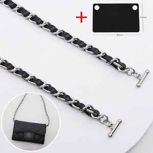 May include: A silver-tone metal chain strap interwoven with black material, featuring toggle bar ends. Includes a black rectangular tag measuring 8.5 cm by 5.4 cm and an inset showing a quilted black bag with the chain attached.