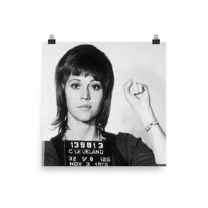 May include: Black and white mugshot photo of a woman with short, dark hair. The photo includes the text "139813", "CLEVELAND", "32 5 8 126", and "NOV 3 1970".