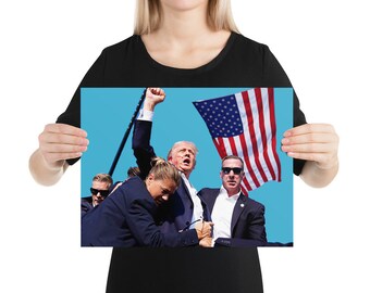 May include: A poster featuring a group of people, including a man with blonde hair raising his fist, and an American flag waving in the background against a blue sky. The image has a political theme.