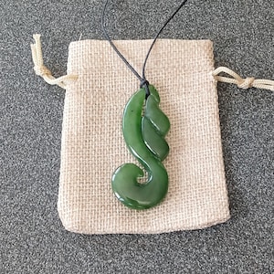 Greenstone Necklace New Zealand Jade Pounamu Handcrafted Jewelry Unique Intricate Design a significant piece of jewelry with cultural value