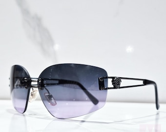 Gafas de sol Gianni Versace X54 sin montura vintage Y2K, años 2000, en tonos violeta.