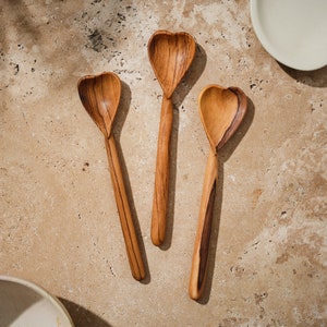 Three hand-carved, heart-shaped olive wood spoons, ethically sourced from Kenya, Africa