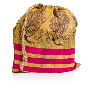 May include: A drawstring bag made of fabric with a peacock design in brown and gold. The bag has pink and gold stripes and a brown rope drawstring.