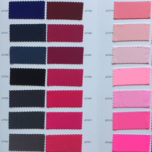 May include: A color chart with fabric swatches in various shades of blue, red, pink, and purple. The swatches are labeled with numbers, such as JDT055, JDT064, and JDT073.
