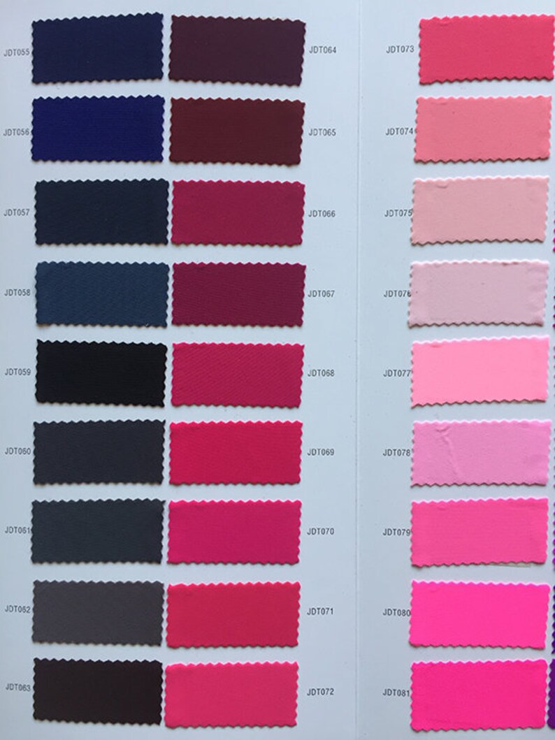 May include: A color chart with fabric swatches in various shades of blue, red, pink, and purple. The swatches are labeled with numbers, such as JDT055, JDT064, and JDT073.