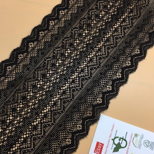May include: Black lace trim with a geometric pattern. The trim has a scalloped edge. The trim is on a light brown surface. The text on the card reads "Etsy New Recycled, New Lifestyle! An environmentally friendly fiber. Recycled Extra Print Support to custom print!"
