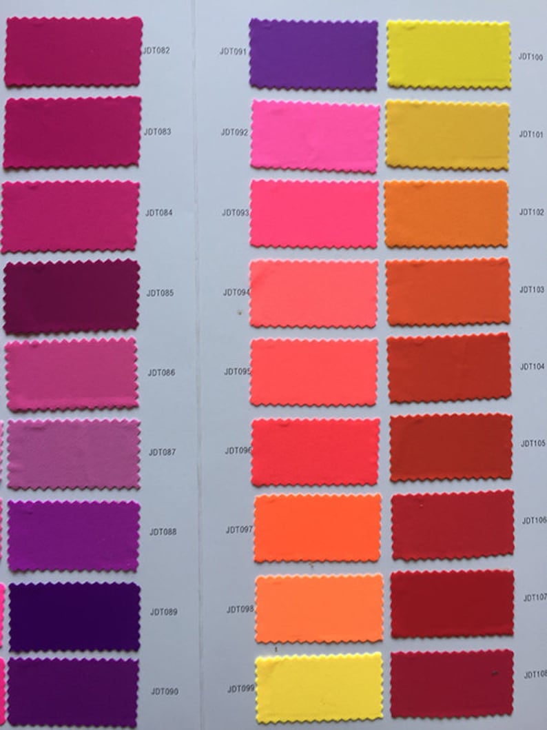 May include: A color chart with 10 rows of fabric swatches. Each row has 3 swatches, with a total of 30 swatches. The swatches are in various shades of pink, purple, orange, red, and yellow. Each swatch is labeled with a code, such as JDT082, JDT091, and JDT100.