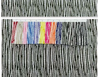 May include: A fabric swatch display featuring a black and white vertical textured stripe pattern. A white header strip numbered 1 through 12 sits above twelve distinct color variations of the same striped fabric, including red, tan, pink, blue, purple, yellow, neon pink, orange, and black.