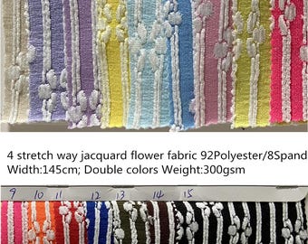 May include: A swatch card showing 15 different colors of stretch way jacquard flower fabric. The fabric is 92% polyester and 8% spandex, with a width of 145 cm and a weight of 300 gsm. The colors include white, purple, yellow, blue, pink, red, orange, blue, green, brown, and black.