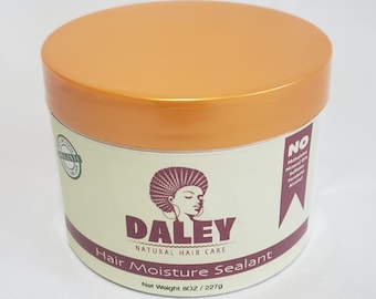 May include: A round orange jar with a white label that says "Daley Natural Hair Care Hair Moisture Sealant Net Weight 8 OZ / 227g". The jar has a black and white illustration of a woman with an afro.