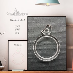 May include: A digital design file for a bird on a ring. The design is shown on a black background. The files included are SVG, DXF, and EPS.