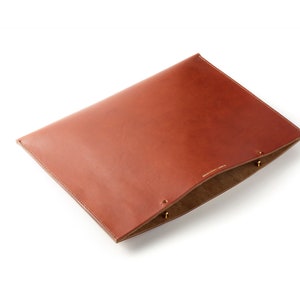 Laptop sleeve made with vegetable tanned leather, suede lined and hand stitched in linen thread. image 1